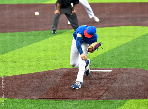 Young athletic boys playing baseball photo