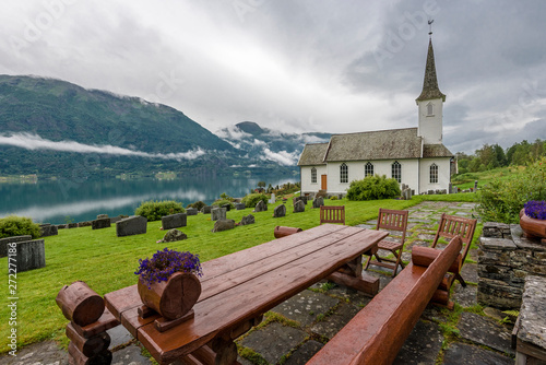 Nes church in the border of Lustrafjorden. Hoyheimsvik, Norway. photo