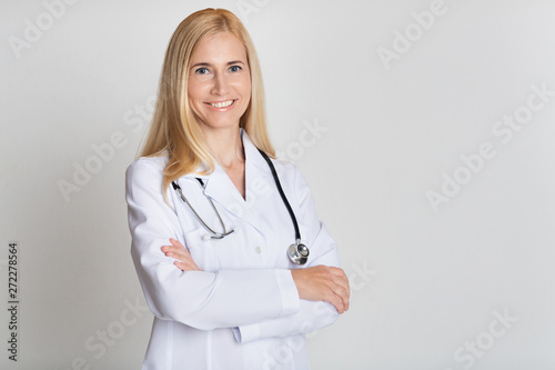 Happy Middle-Aged Medical Worker In Uniform With Stethoscope