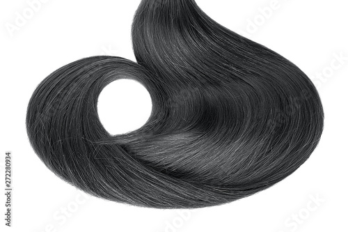 Black hair isolated on white background. Long wavy ponytail