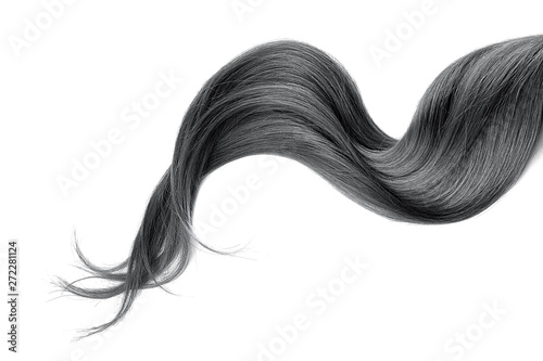 Leinwand Poster Black hair isolated on white background. Long wavy ponytail