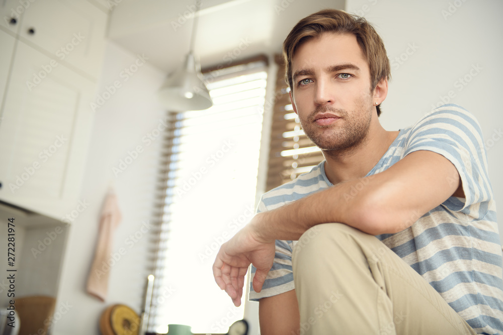 owner sits in kitchen owner sits in kitchen