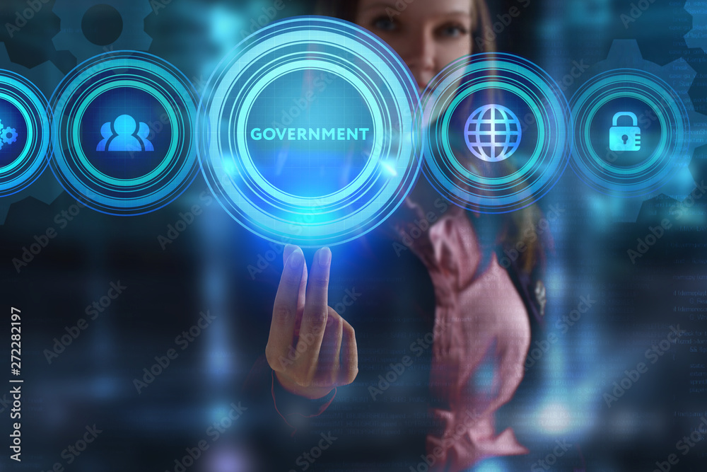 The concept of business, technology, the Internet and the network. A young entrepreneur working on a virtual screen of the future and sees the inscription: Government The concept of business, technology, the Internet and the network. A young entrepreneur working on a virtual screen of the future and sees the inscription: Government
