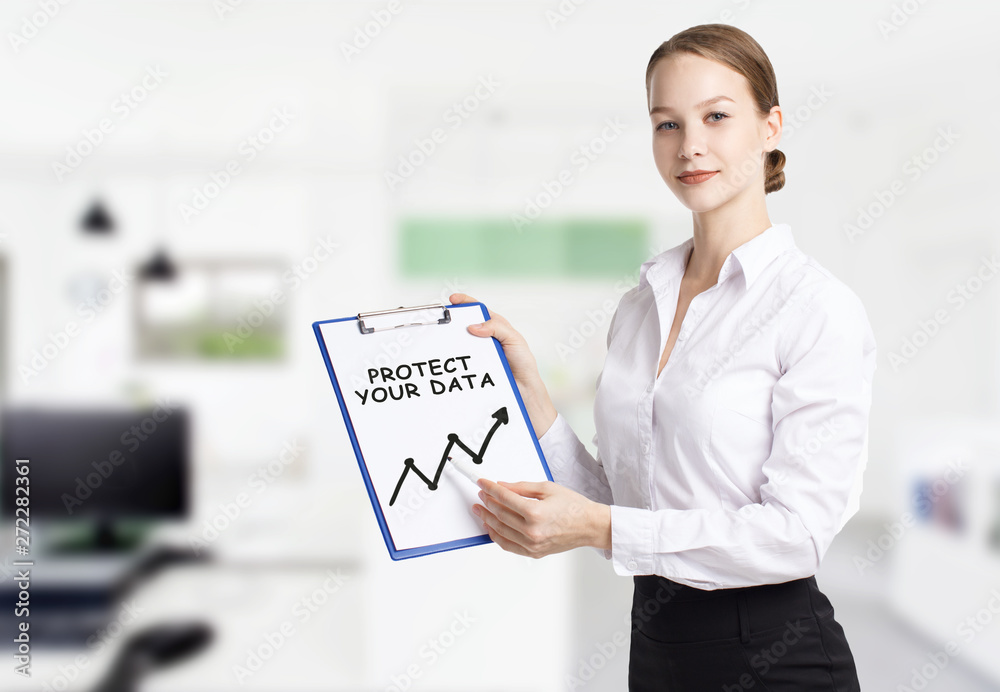 Business, technology, internet and networking concept. Young entrepreneur showing keyword: Protect your data Business, technology, internet and networking concept. Young entrepreneur showing keyword: Protect your data