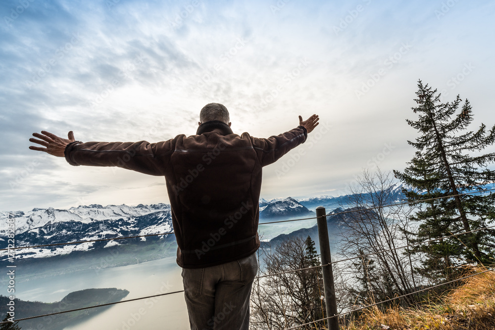 The figure of a man on top of a mountain. The desire to fly away. The figure of a man on top of a mountain. The desire to fly away.