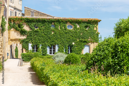 Lauris, France. 06-05-2019. Old houses and garden at Lauris village in Provence, France.