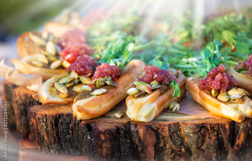 Tasty healthy bruschetta with salmon. Catering serve at sunny day Tasty healthy bruschetta with salmon. Catering serve at sunny day