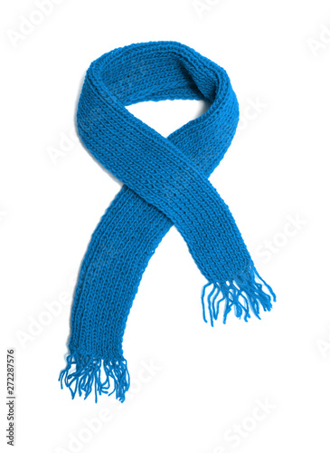 Bild auf Leinwand Blue knitted scarf on a white background.