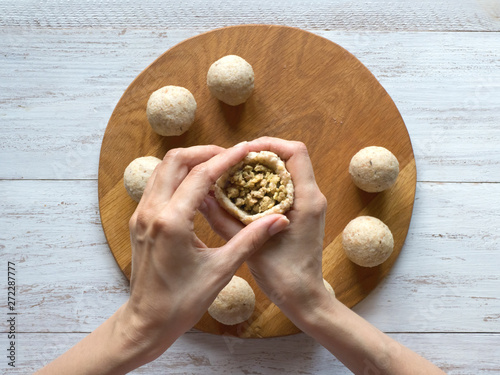 Cooking of Arabic meat appetizer Kibbeh.  photo