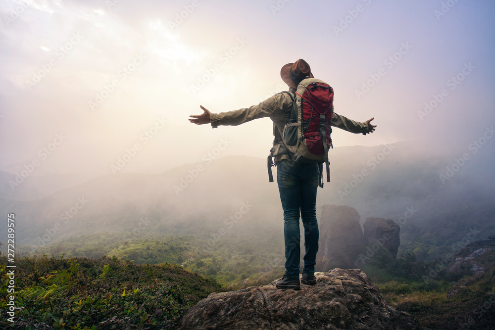 Man hiker standing in the mountains.