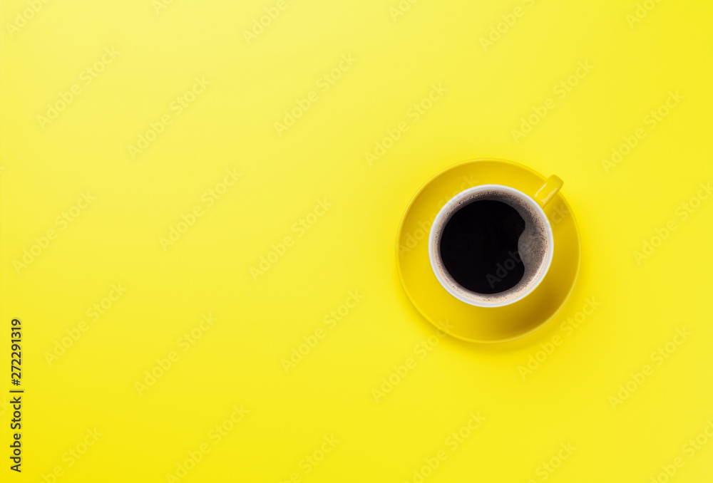 Yellow coffee cup over yellow background