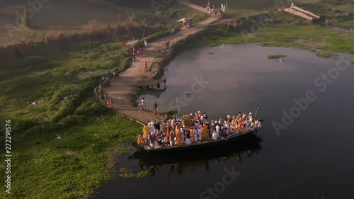 Hare Krishna pilgrims procession in a boat, Mayapur, India, 4k aerial  photo