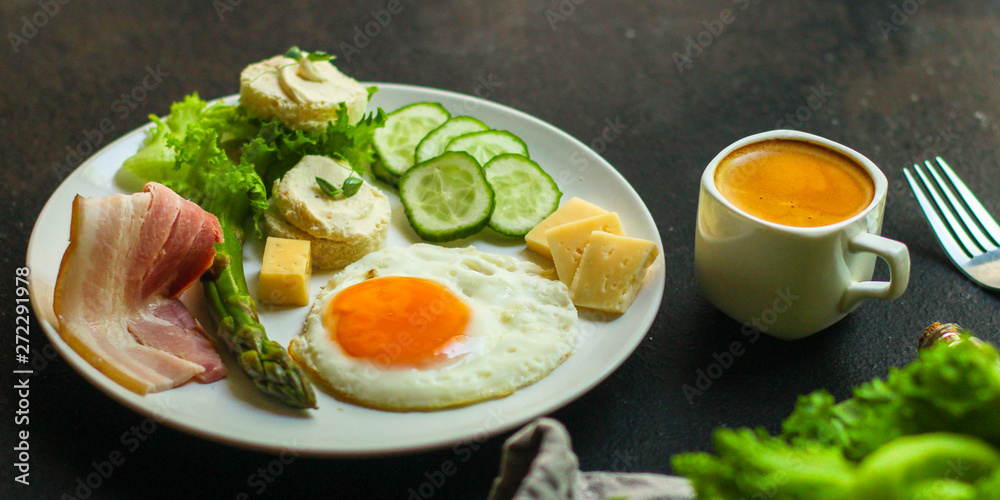 healthy food - breakfast (scrambled eggs, bacon, lettuce, asparagus, cucumbers, cheese, sandwich). food background. top view. copy space