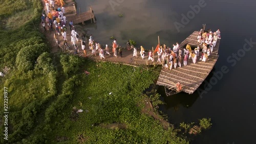 Hare Krishna pilgrims procession in a boat, Mayapur, India, 4k aerial  photo