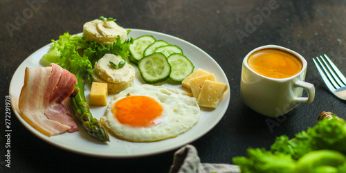 healthy food - breakfast (scrambled eggs, bacon, lettuce, asparagus, cucumbers, cheese, sandwich). food background. top view. copy space