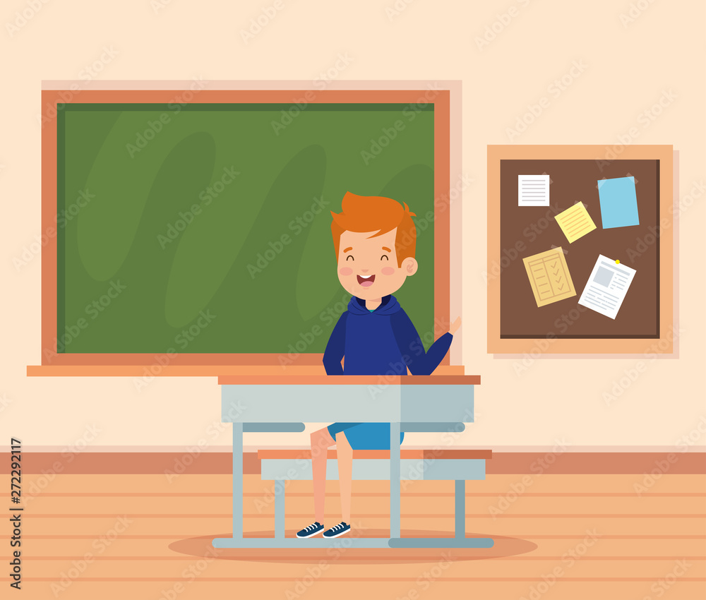 boy child in the classroom with desk and blackboard boy child in the classroom with desk and blackboard