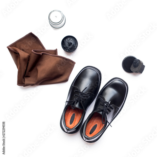 Black leather shoes shoe polish white background