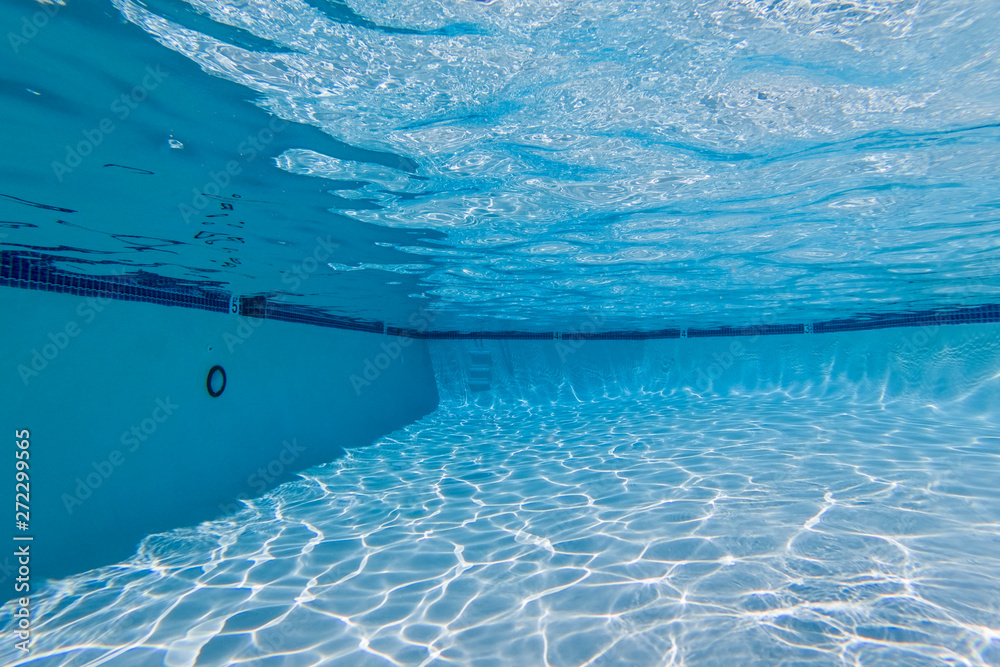 Underwater view in clean refreshing swimming pool.
