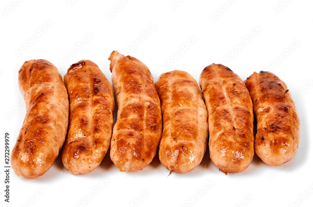Meat sausages with glitter on a light background. Fried sausage. The concept of traditional cuisine.
