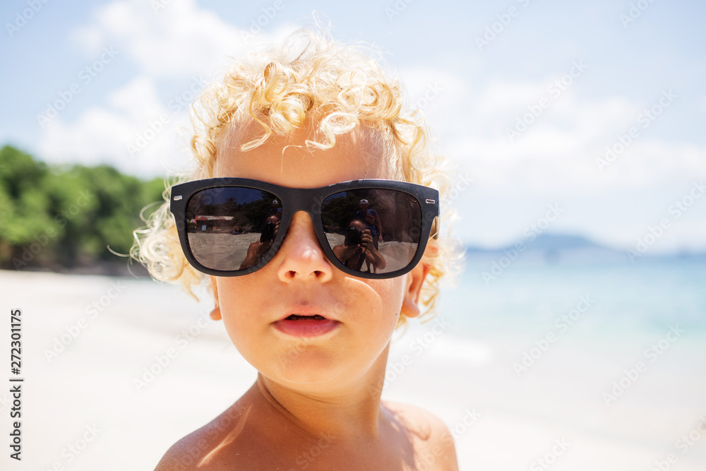 boy are playing on the beach boy are playing on the beach