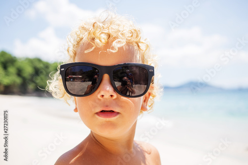  boy are playing on the beach