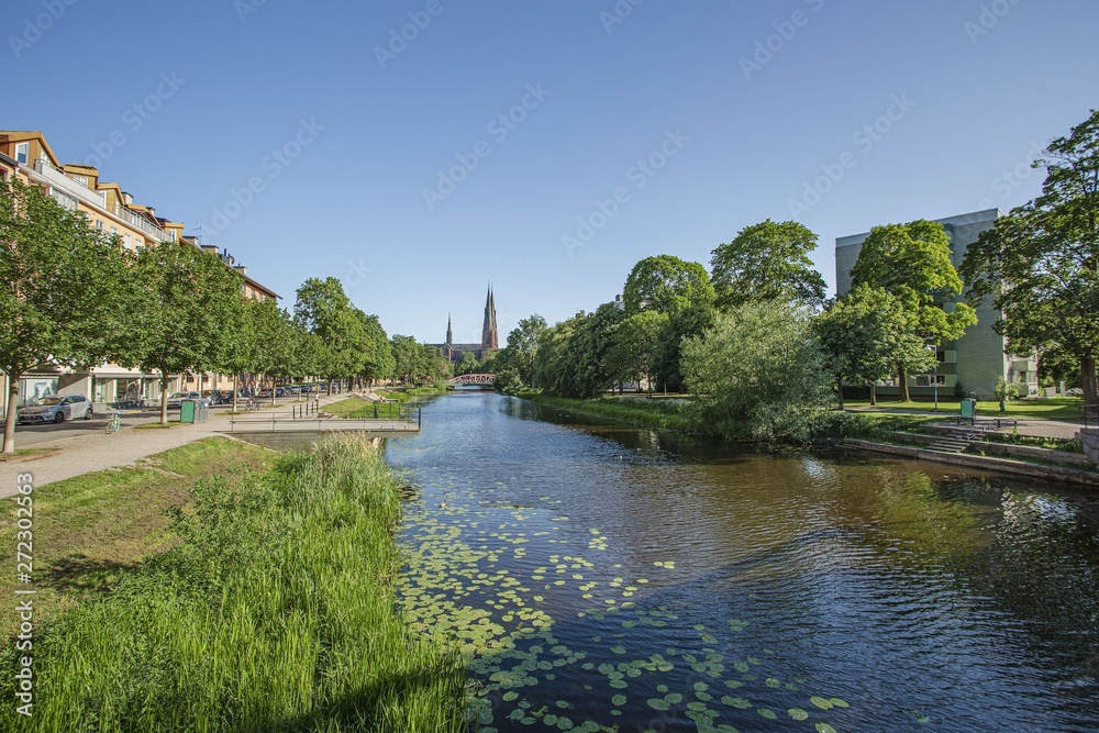 Gorgeous view on town street with cathedral on background. Tourism, travel concept. Europe, Sweden, Uppsala.