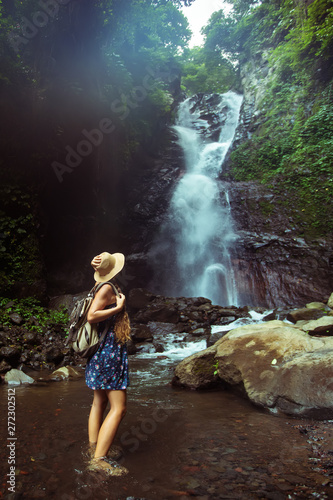 Woman near waterfal on Bali  Indonesia  