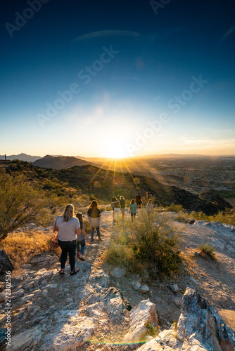 Sunset on south mountain in Phoenix Arizona Hikers and children in wonder