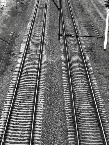 Railroad tracks black white gloomy atmosphere