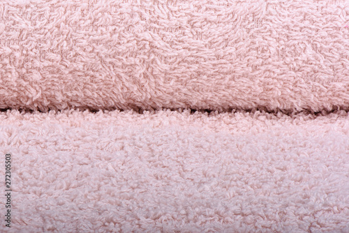 Light pink terry towel. The texture of the cloth towels.