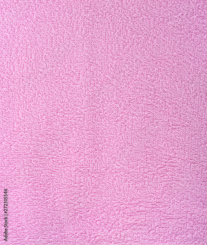 The texture of the fabric is pink terry towel. Terry cloth as a background.