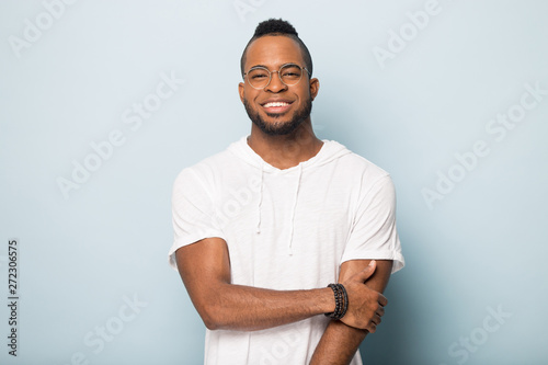 Happy smiling young black man posing for portrait.