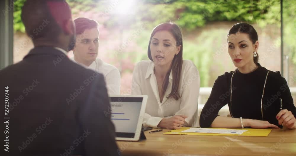4K Business negotiations going badly, unfriendly panel interviewing businessman. Slow motion.