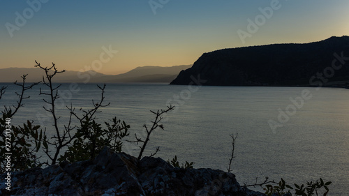 Beautiful sunset on the black sea, evening view of the mountains, Vesele bay in the Sudak Municipality of the Crimea photo