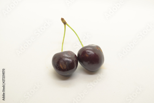two cherries on white background