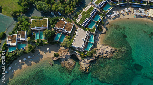 Aerial top view photo of tropical sandy paradise beach with pool facilities in exotic island © aerial-drone
