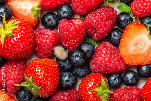Fresh summer berries such as blueberries  strawberries  raspberries  top view