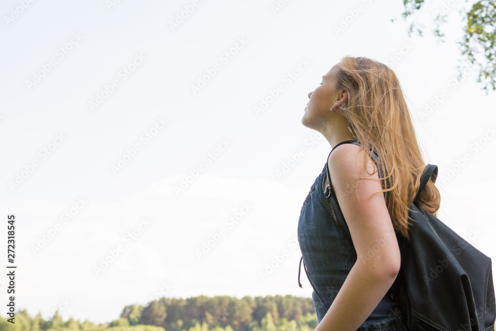 millenial woman traveler with a backpack looking at amazing lake and forest, concept of traveling wandering lust, place for text, atmospheric epic moment millenial woman traveler with a backpack looking at amazing lake and forest, concept of traveling wandering lust, place for text, atmospheric epic moment