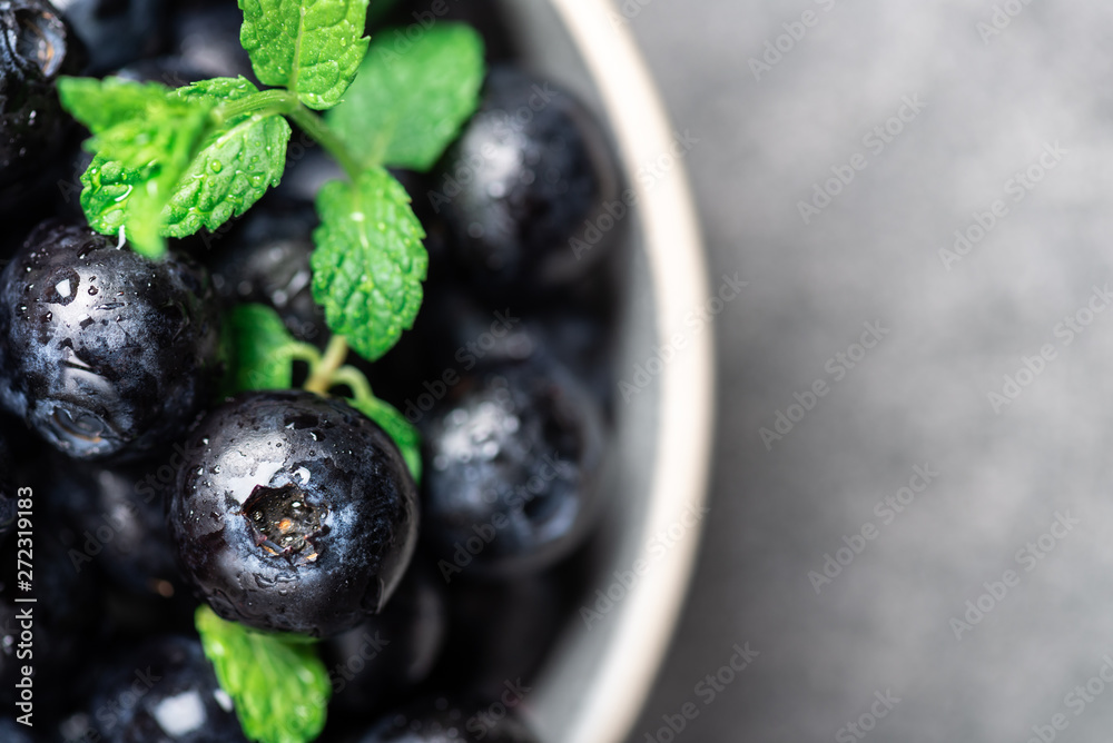 Fresh summer berries such as blueberries in the bowl, top view Fresh summer berries such as blueberries in the bowl, top view