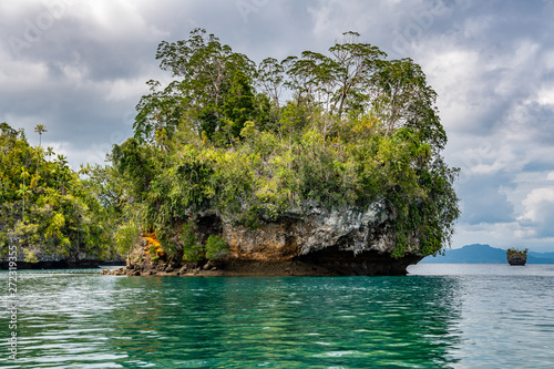 Waigeo, Kri, Mushroom Island, group of small islands in shallow blue lagoon water, Raja Ampat, West Papua, Indonesia photo