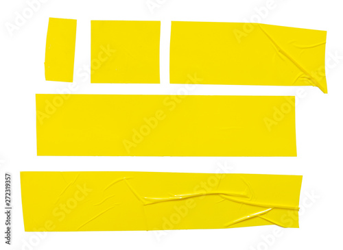 Set of  different yellow sticky tapes. Torn crumpled sellotape pieces isolated on white background