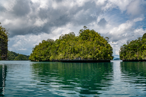Waigeo, Kri, Mushroom Island, group of small islands in shallow blue lagoon water, Raja Ampat, West Papua, Indonesia photo
