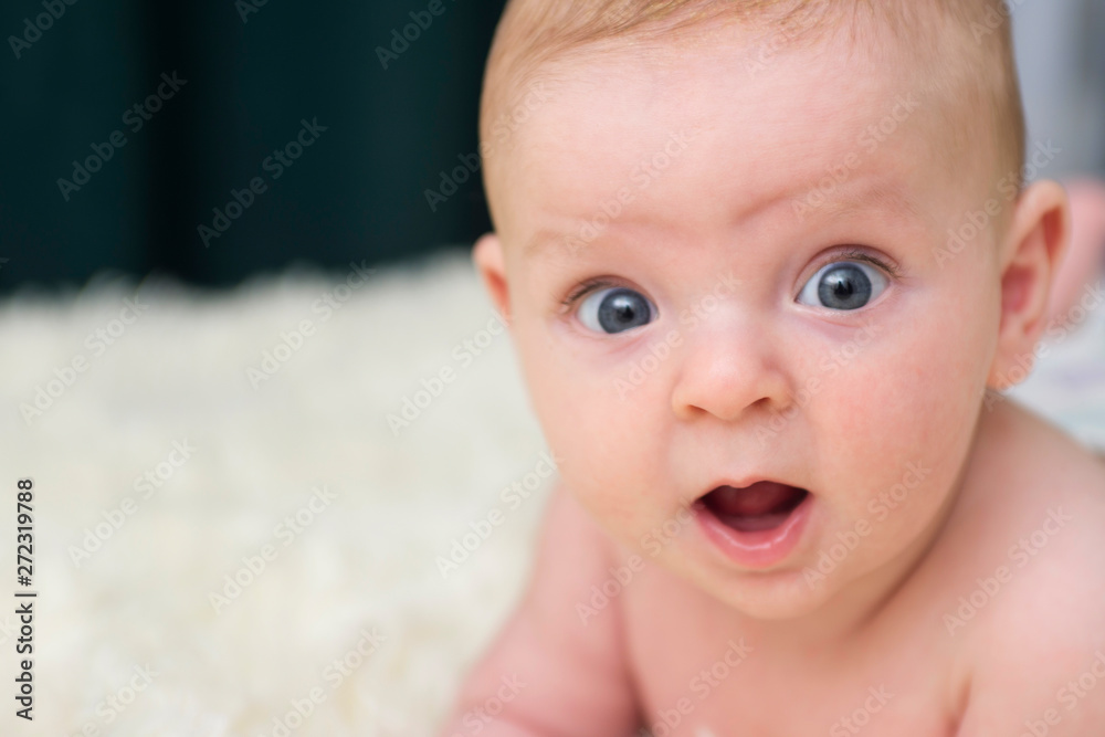 Surprised baby. newborn Baby portrait with funny shocked face expression