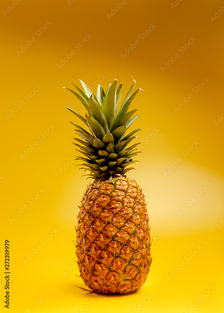 pineapple on yellow background pineapple on yellow background
