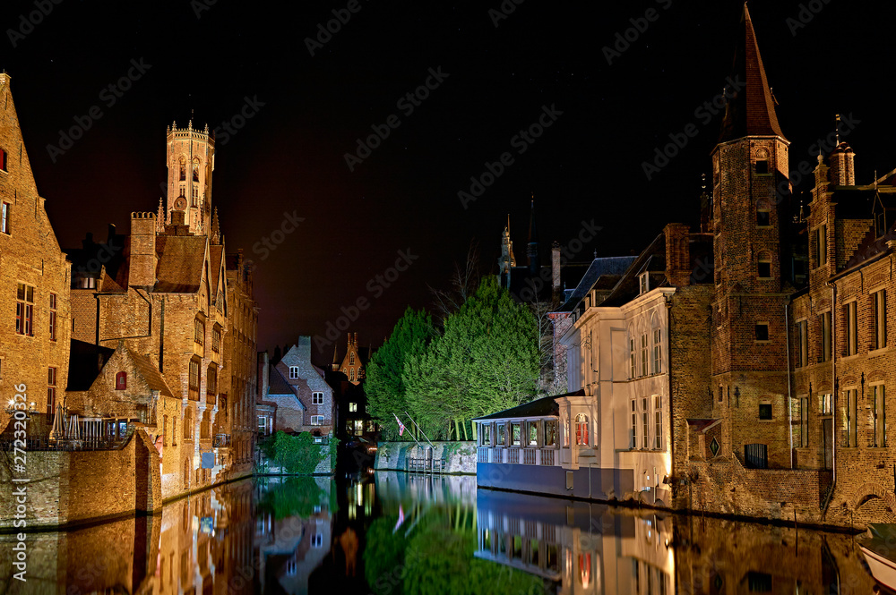 buildings on the canals of bruges by night