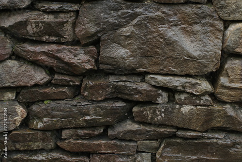 the wet wall is made of stones