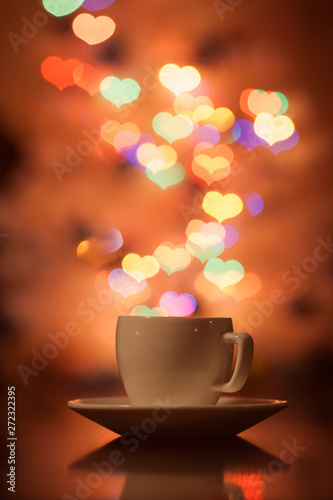 Cup of tea in the background bokeh in the form of hearts