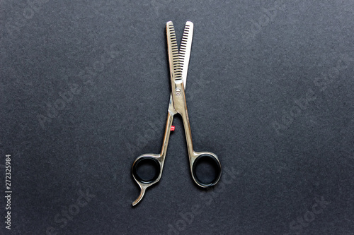 Professional opened hair scissors on black