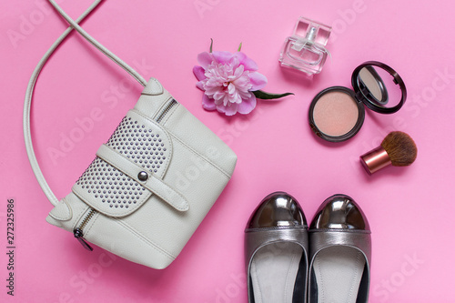 Composition with fashion accessories on pink background