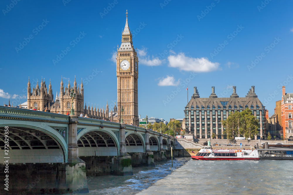 Big Ben and Houses of Parliament with boat in London, England, UK